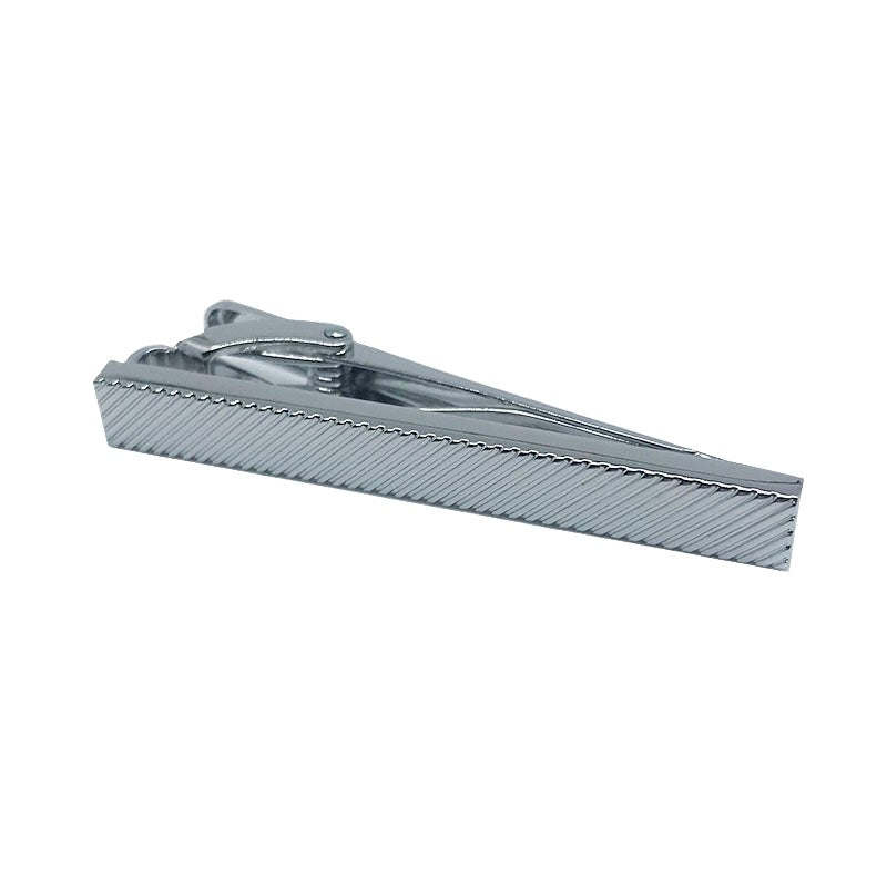 silver tie clip with a diagonal imprint over it