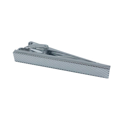 silver tie clip with a diagonal imprint over it